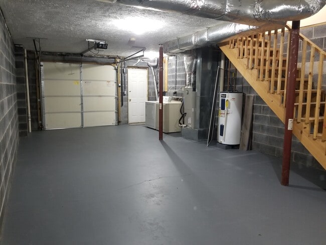 Basement: 2-car garage (if parked bumper to bumper) or 1 car garage with room for storage. Washer and dryer. - 343 Beaverview Dr Townhome
