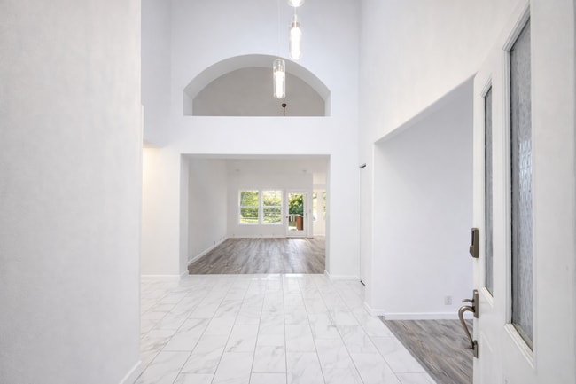 Photo - Executive 3 Bed Home with 3 Car Garage & Private Fenced Yard