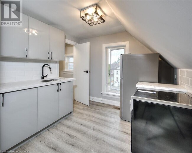 Photo - Unbeatable Value! Den Unit on Top Floor in Kitchener | $1299 ALL-INCLUSIVE | Parking & Laundry Unit 4