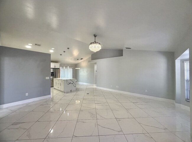 Photo - Stunning 3 Bedroom + Den Home with Fence + Screened Lanai in Great Location!