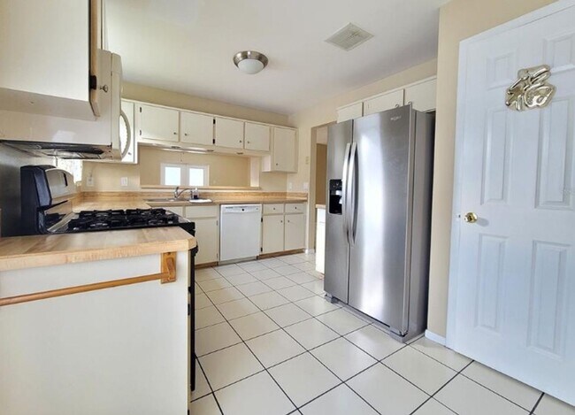 Photo - Charming 3-Bedroom Home with Pool, 2-Car Garage, and Tile Flooring Throughout!