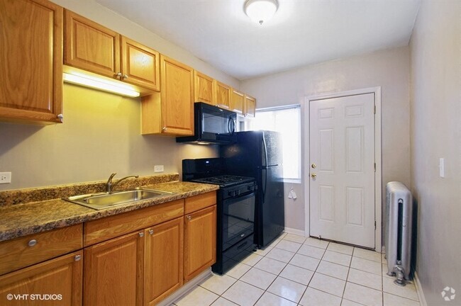 Bright kitchen with black appliances - 1338 W Argyle Rental