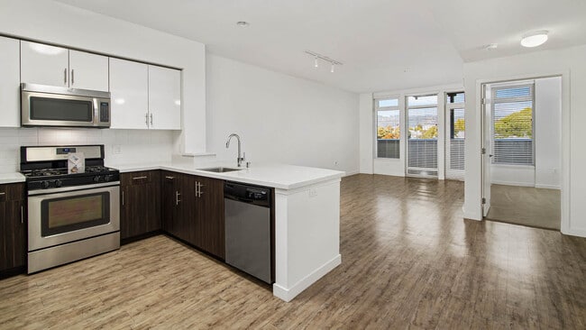 Kitchen and Living Room with Balcony and Hard Surface Flooring - Parc on Powell