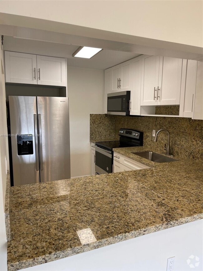 Building Photo - 6090 W 18th Ave Unit 332 Rental