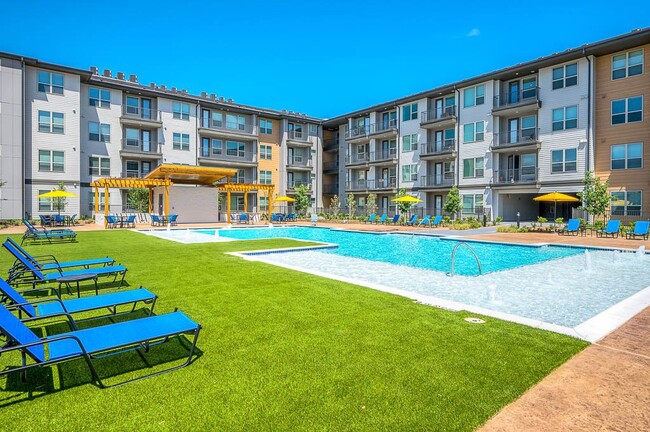 view of pool with a yard and a pergola - Avasa Spring Branch Apartments