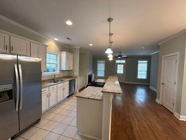 Photo - Enjoy private living in this beautiful 3 bedroom, 2.5 bathroom home on almost half acre lot!