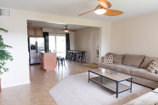 Shared Living room and kitchen space - 7561 E Belleview St Unit Belleview House