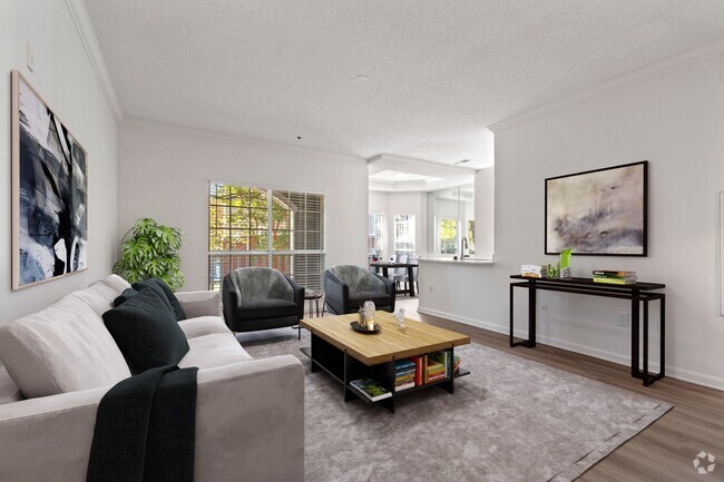 Living room with large floor to ceiling windows that offer an abundance of light - Windsor Vinings Rental