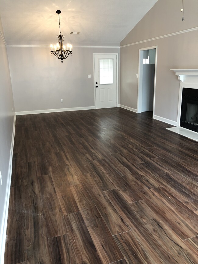 Great room with fireplace - 313 Grace St Townhome