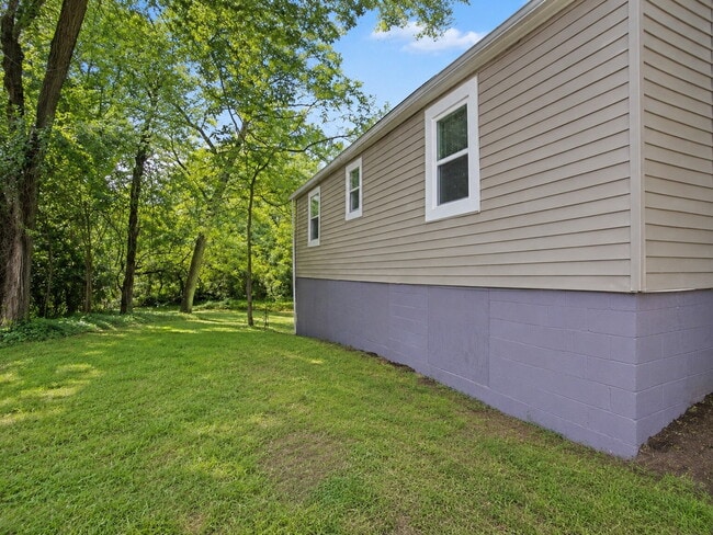 Photo - Bright 3-Bedroom Home with Covered Porch, Fireplace & Wooded Backyard