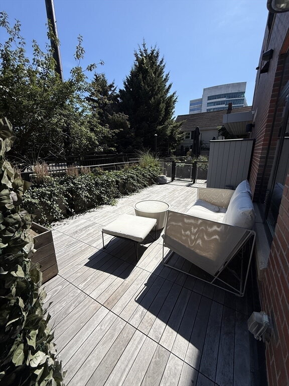 Photo - "Charming 1-Bed Boston Retreat with Granite Touches, Cozy Fireplace & Hardwood Elegance!"