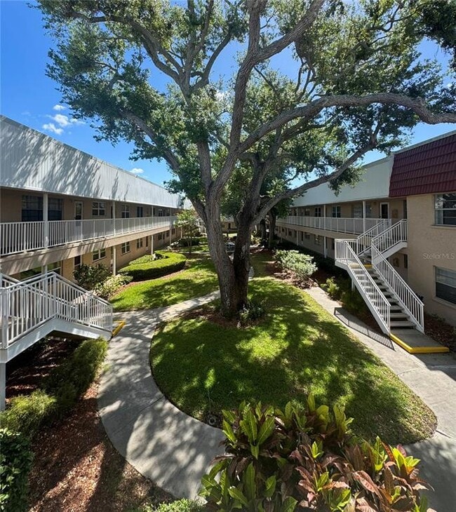 Building Photo - 10036 63rd Ave N Unit 23