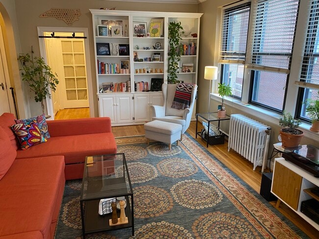 Living room with built in shelves - 4007 Connecticut Ave NW Unit 409