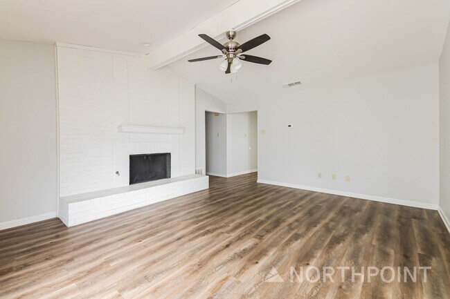 Photo - 3 BR/2BA | Newly Renovated Single Family Home | Fireplace in living room | Fenced backyard!