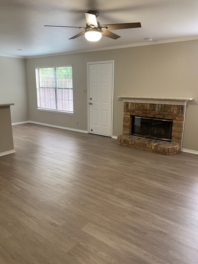 Living Room w/ wood burning fireplace - 129 Wildwood Ct Unit D