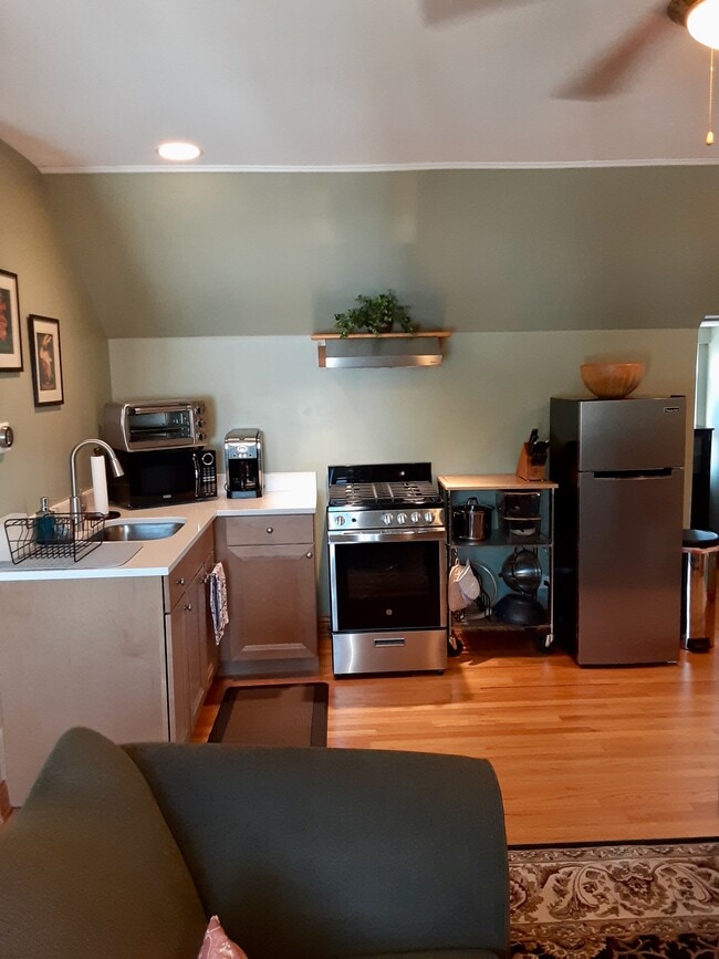 Kitchen with new appliances. Gas stove, Fridge, microwave, toaster oven, coffee maker, etc. - 2422 N Drake Ave Unit 3rdFloor