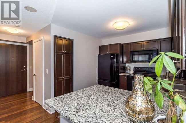 Photo - 125 Village Green Square Unit 1409