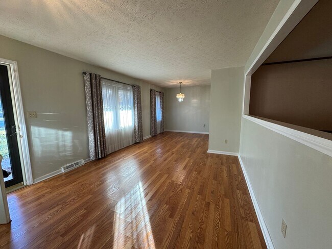 Photo - Spacious three bedroom, two bathroom with covered back porch and detached garage located on Cave ...