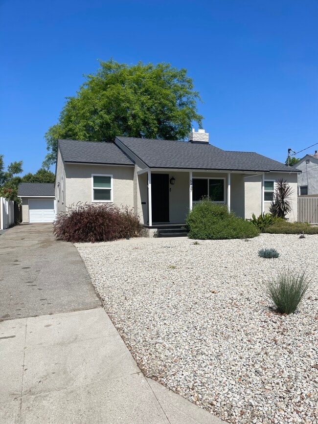 6 Car Driveway with gated entrance leading to 2 Car Garage