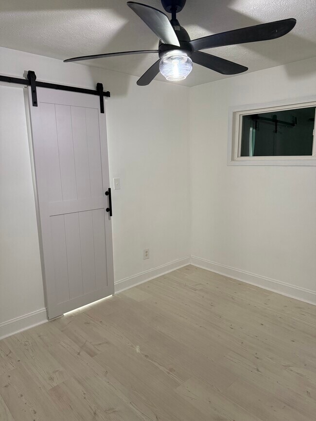 2 bedrooms with Updated Barn doors & new ceiling fan