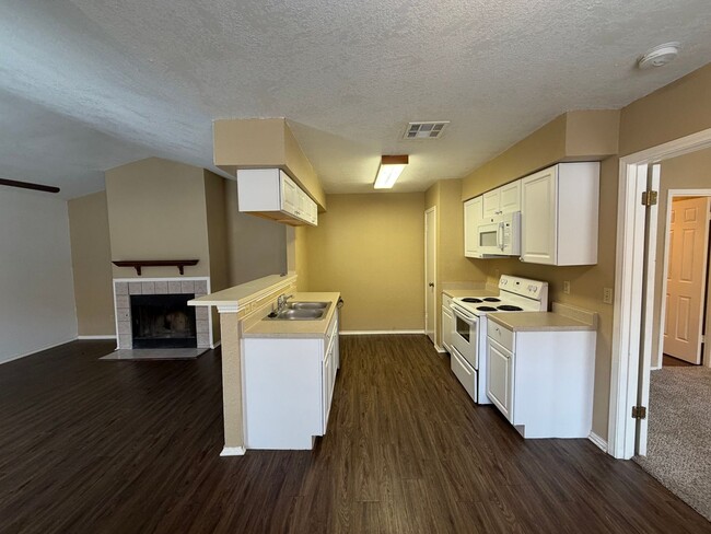 Photo - Welcome home to this charming 2-bedroom, 2-bathroom duplex located in Woodstone Subdivision - loc...