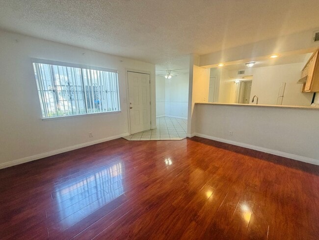 Photo - Super central 2 bedroom condo with tile & laminate flooring and in unit laundry! Home is very con...