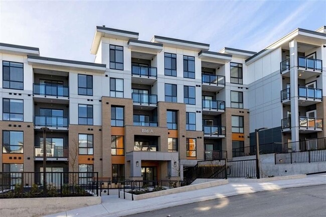 Building Photo - Bright 1 Bed Condo Backing Onto Greenbelt in Park Hill Willoughby Heights Unit A208