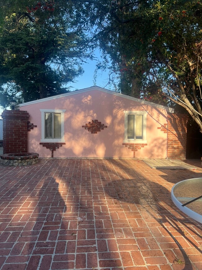 Western side of Guesthouse looking onto Brick patio