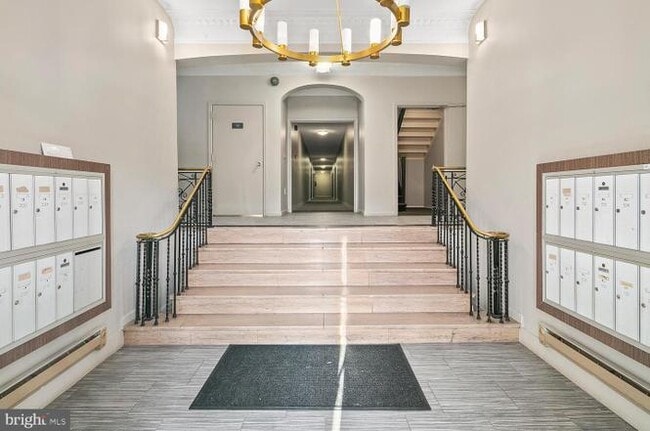 Building lobby with locked mailboxes for each unit - 3719 12th St NE Unit 202