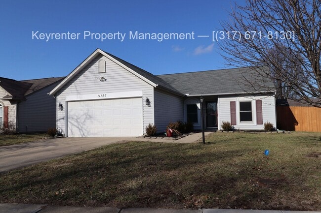 Building Photo - Discover this well-maintained 3-bedroom, 2-bath home in Indianapolis featuring an attached garage...