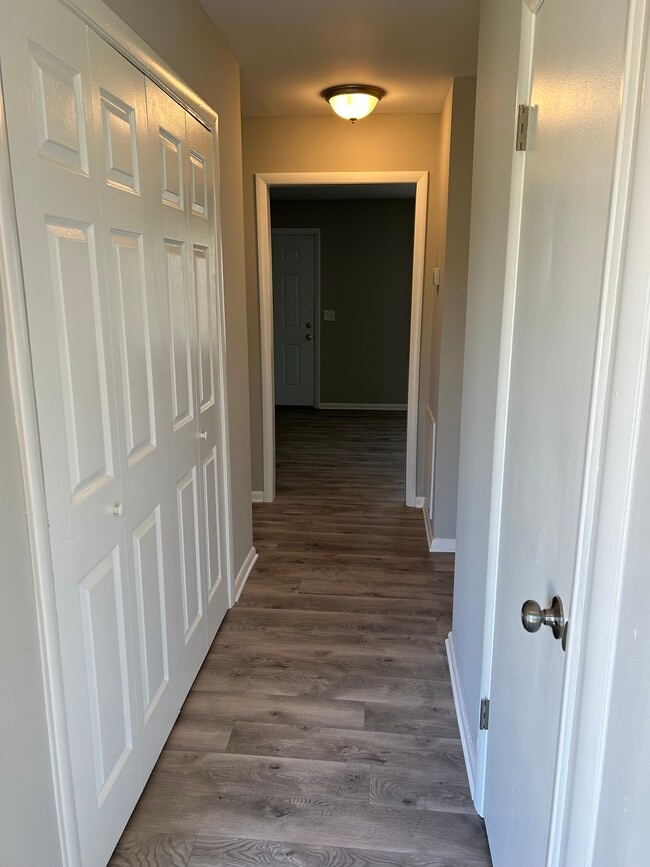 hall with closets and utility room - 810 Lillard Rd Unit Lillard 810
