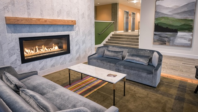 Indoor fireplace with sofas in lobby lounge