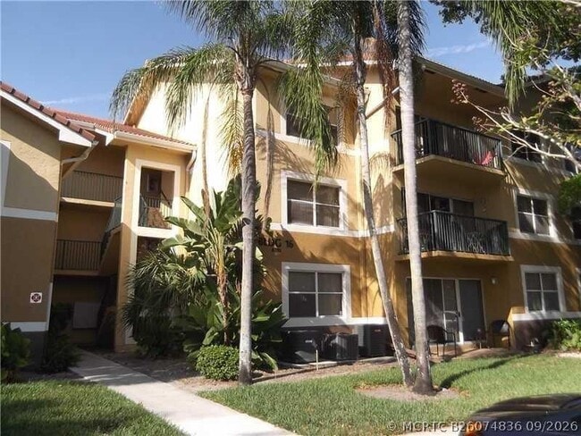 Building Photo - 8701 Wiles Rd Unit 204