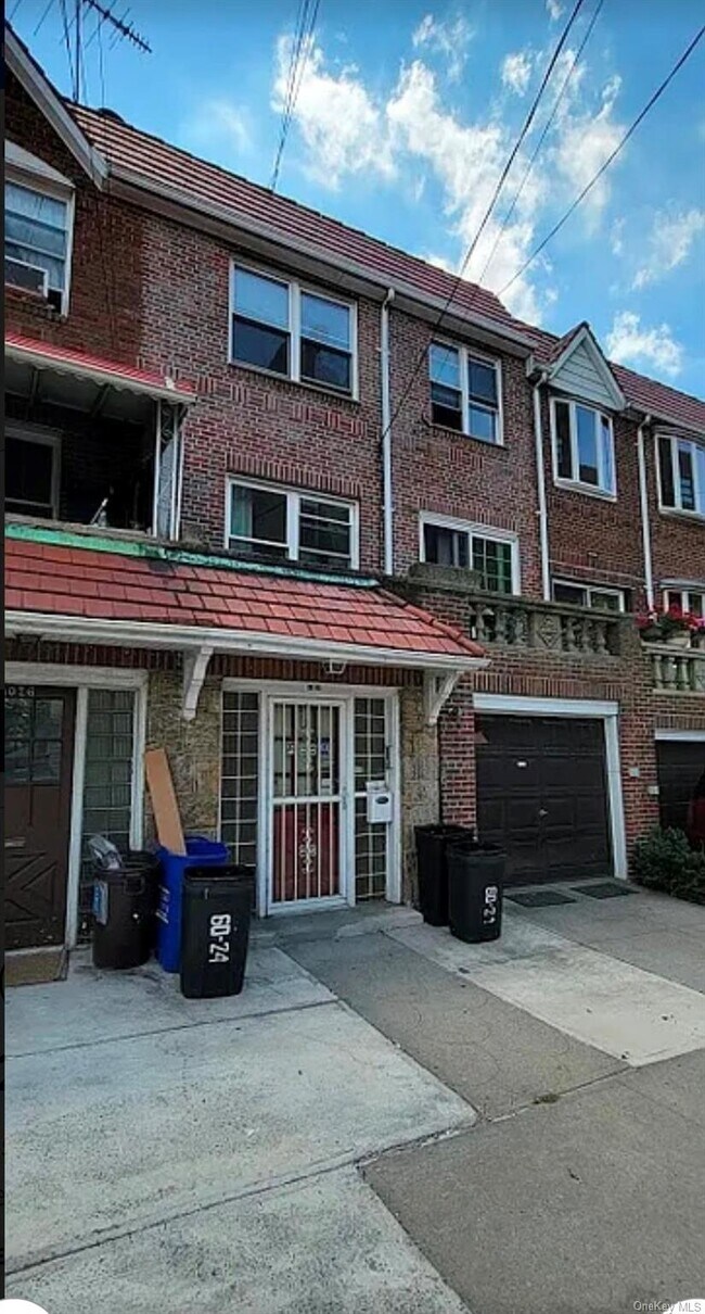 Building Photo - 60-24 Wetherole St Unit 1