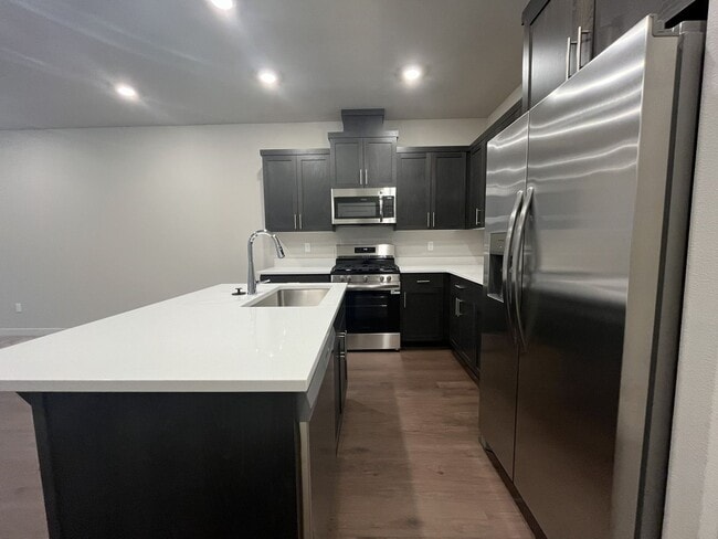 Photo - Exceptional 3-Bedroom Modern Home with Island Kitchen, Spacious Living, and Attached Garage