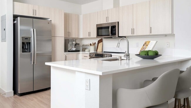New quartz countertops and fixtures in our newly upgraded units in the North Building - Metro 112 Apartments