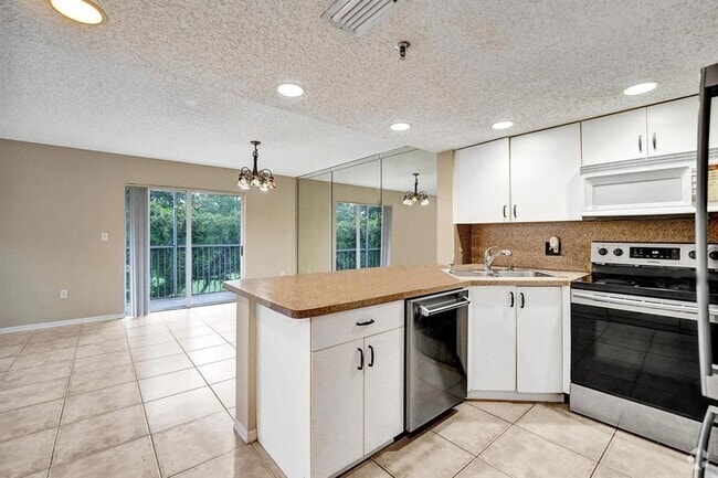 Building Photo - 9470 Tangerine Pl Unit 301 Rental