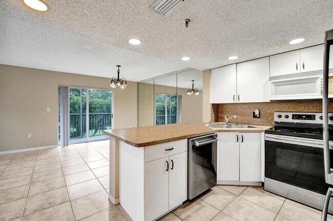 Building Photo - 9470 Tangerine Pl Unit 301 Rental