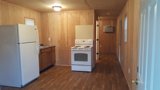 Full kitchen, hallway leading to bed and bath. - 4182 FLOYD JOHNSTON RD Unit #2