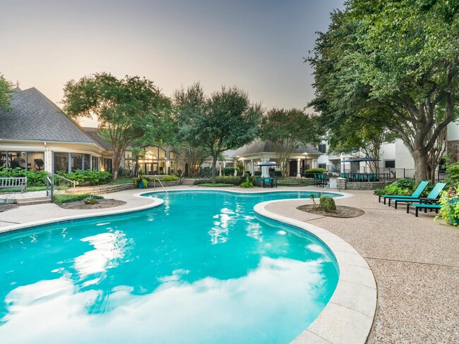 Surrounded by mature trees and thoughtful landscaping, the resort-style pool invites quiet moments or casual conversation poolside. - Alister Sunset Valley