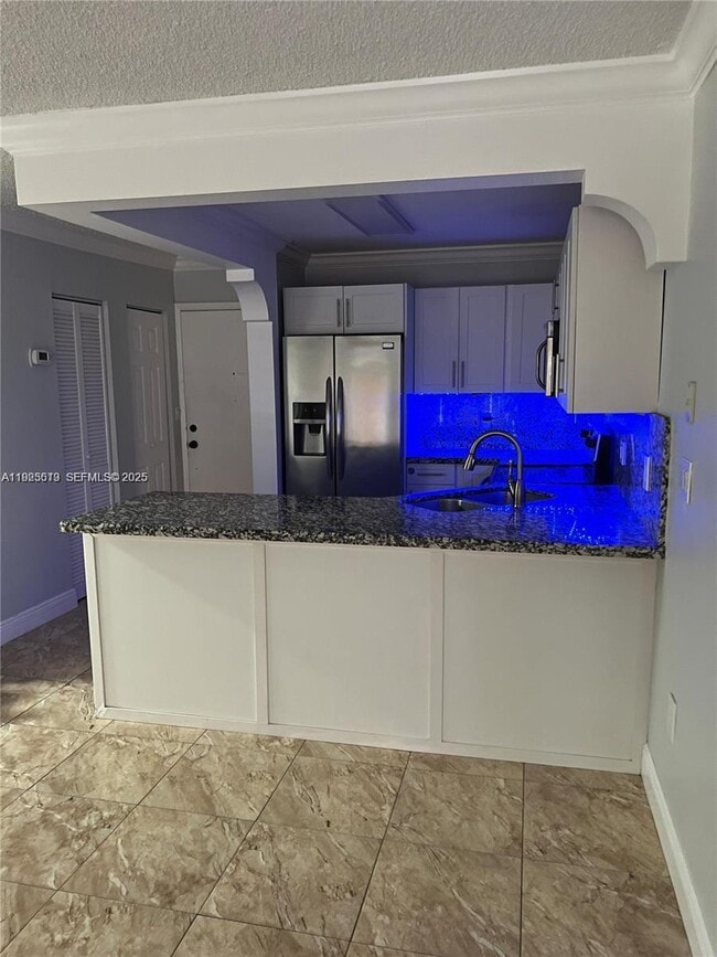 Photo - 1075 W 68th St Unit 218