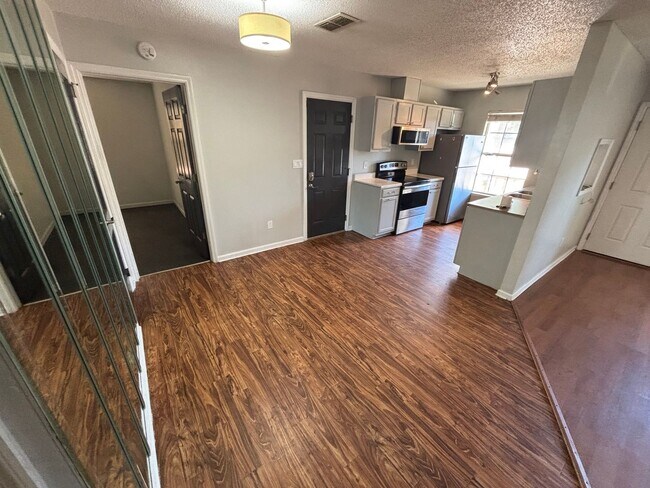 Photo - Spacious 4-Bed, 2-Bath Home with Yard and ...
