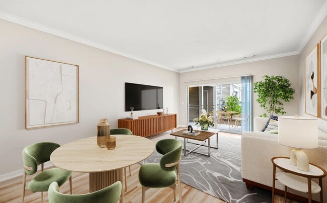 Dining and living areas blend seamlessly with private patio access, creating a bright, flexible space for relaxing, entertaining, and everyday routines.
