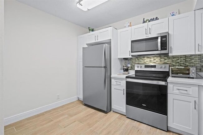 Photo - 8851 Wiles Rd Unit 305
