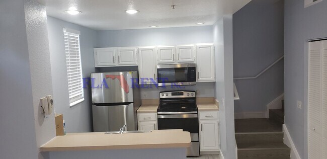 Photo - 4 BR / 3 FULL BATH (INCLUDES 2 MASTERS) 2 STORY (NEAR DISNEY!) GATED COMMUNITY WITH COMMUNITY POO...