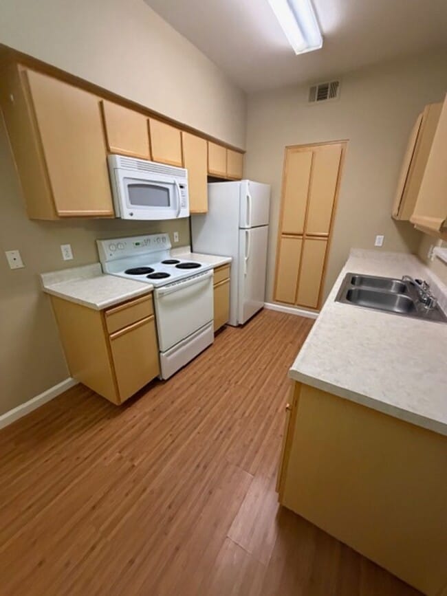 Photo - Discover Your Dream Condo with Stunning Mountain Views a 1 Car Garage & Covered carport in NW Ren...