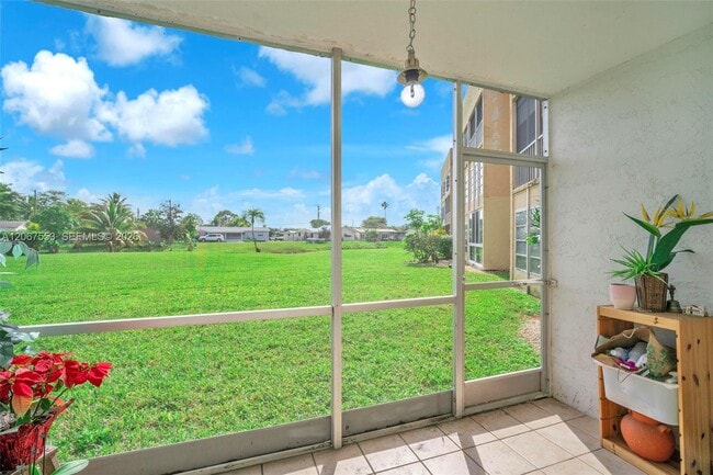 Building Photo - 6550 Royal Palm Blvd Unit 108A