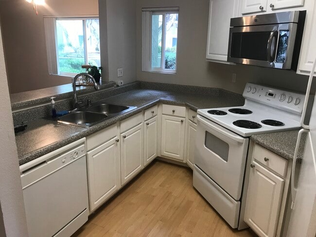 Building Photo - 7525 Charmant Dr Unit 111