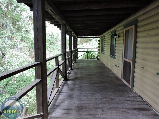 Photo - Cute Log Home Overlooking Wooded Area