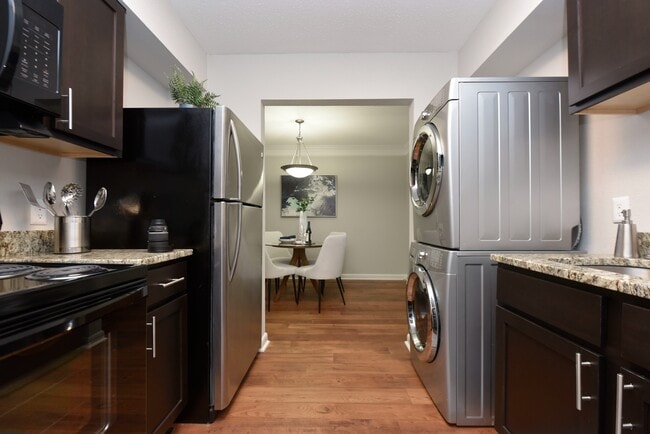 Kitchen with in-home washer & dryer